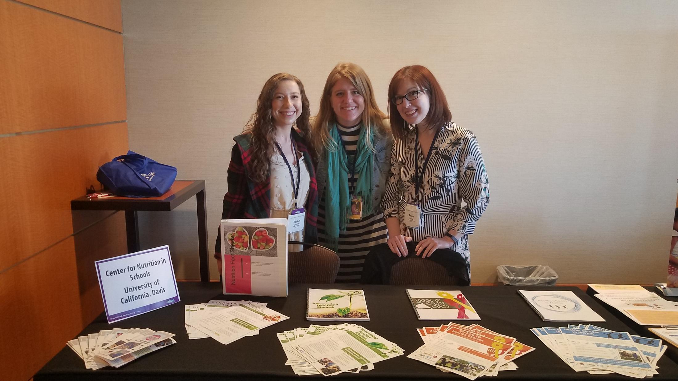 Center staff at information table